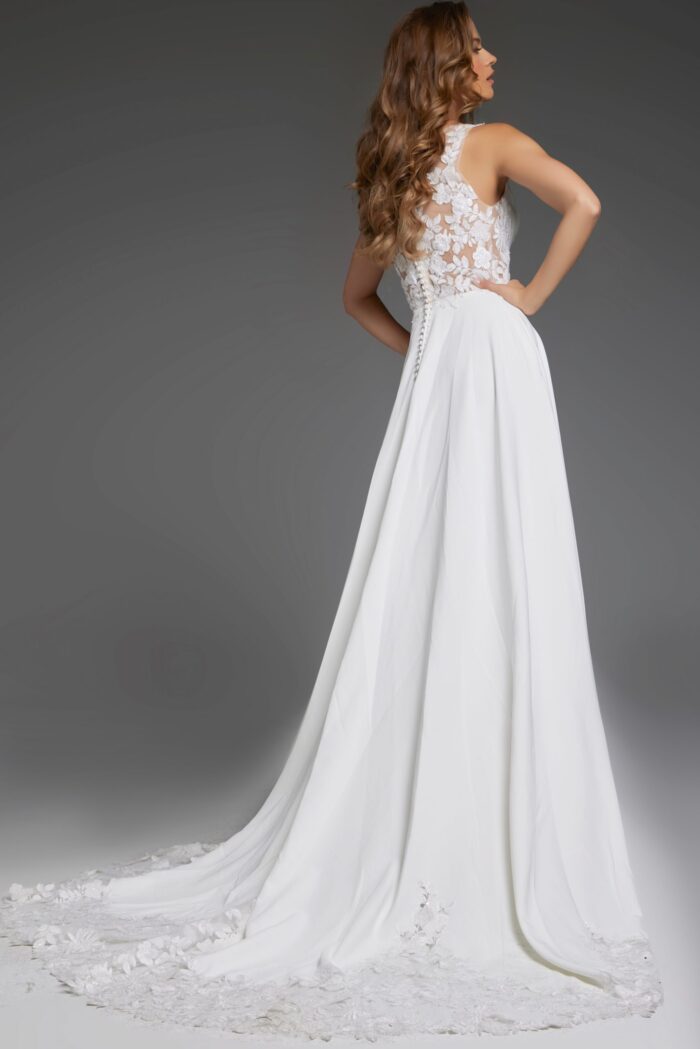 Back view of model wearing Jovani JB42294 ivory gown showing lace detail.