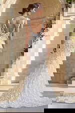 Romantic wedding dress with 3D floral appliqués