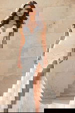 Strapless lace gown with deep V neckline, fitted silhouette, and thigh-high slit