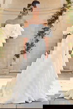 Elegant off shoulder bridal gown with voluminous puff sleeves and soft A line silhouette