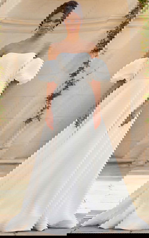 Elegant off shoulder bridal gown with voluminous puff sleeves and soft A line silhouette