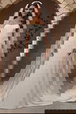 Fitted wedding dress with floral waist appliqué and flowing train