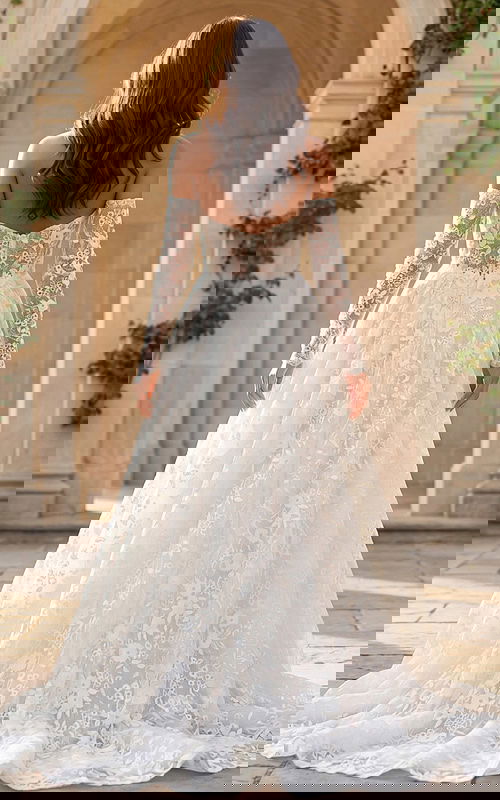 Off shoulder lace A line bridal gown with sheer long sleeves and sheer illusion back.