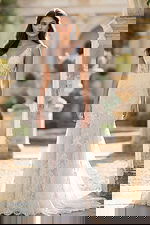 Intricate Lace Wedding Gown with Deep V Neckline and Flowing Train JB43894