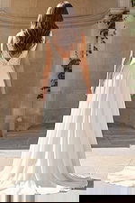 Back view of A line bridal gown with V back and button detail