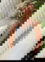 model wearing v neck ruched bodice wedding dress JB45121