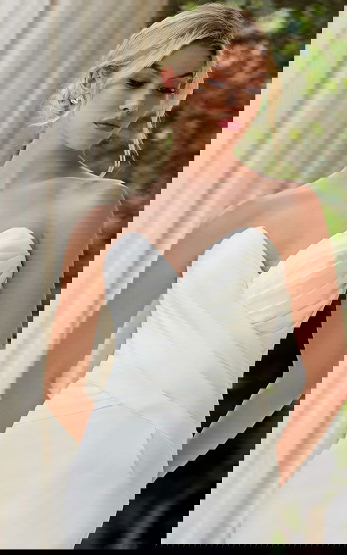 model wearing v neck ruched bodice wedding dress JB45121