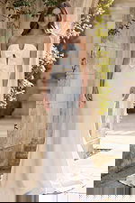 Front view of strapless bridal dress with double bow bodice and sleek silhouette