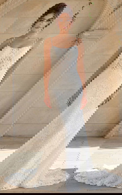 fitted lace bridal dress with low back and soft chapel train