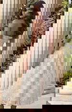 Back view of strapless lace midi dress with open neckline and elegant structure