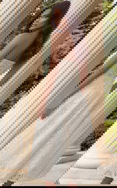 Back view of strapless lace midi dress with open neckline and elegant structure