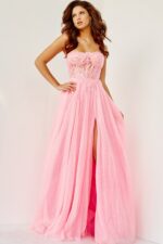 Model wearing Jovani 07434 pink gown with sweetheart neckline and high slit.