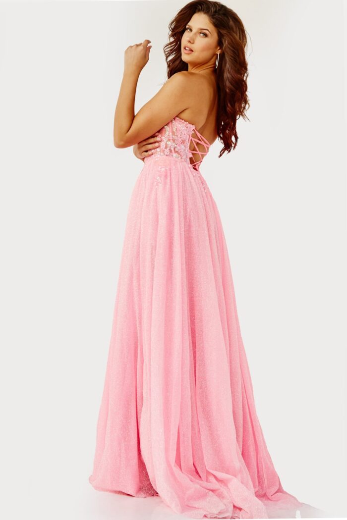 Model wearing Jovani 07434 pink gown with sweetheart neckline and high slit.