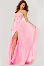Model wearing Jovani 07434 pink gown with sweetheart neckline and high slit.