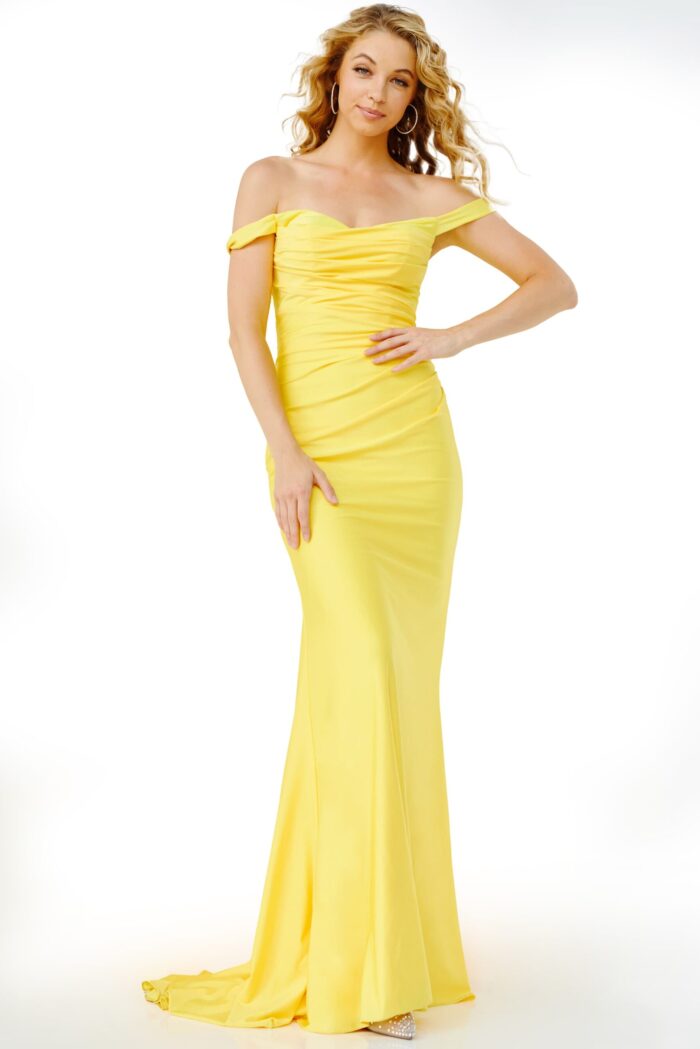Model wearing Jovani 07639 in yellow, off-shoulder gown with sweetheart neckline.