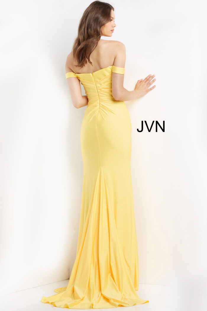 Back view of model in Jovani 07639 yellow gown, displaying elegant fit and off-shoulder style.