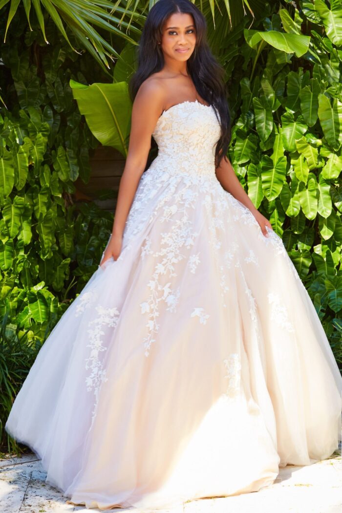 Model wearing Jovani 1831 ball gown in white, front view