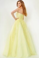 Model wearing Jovani 1831 ball gown in yellow, back view