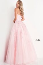 Model wearing Jovani 1831 ball gown in pink, back view