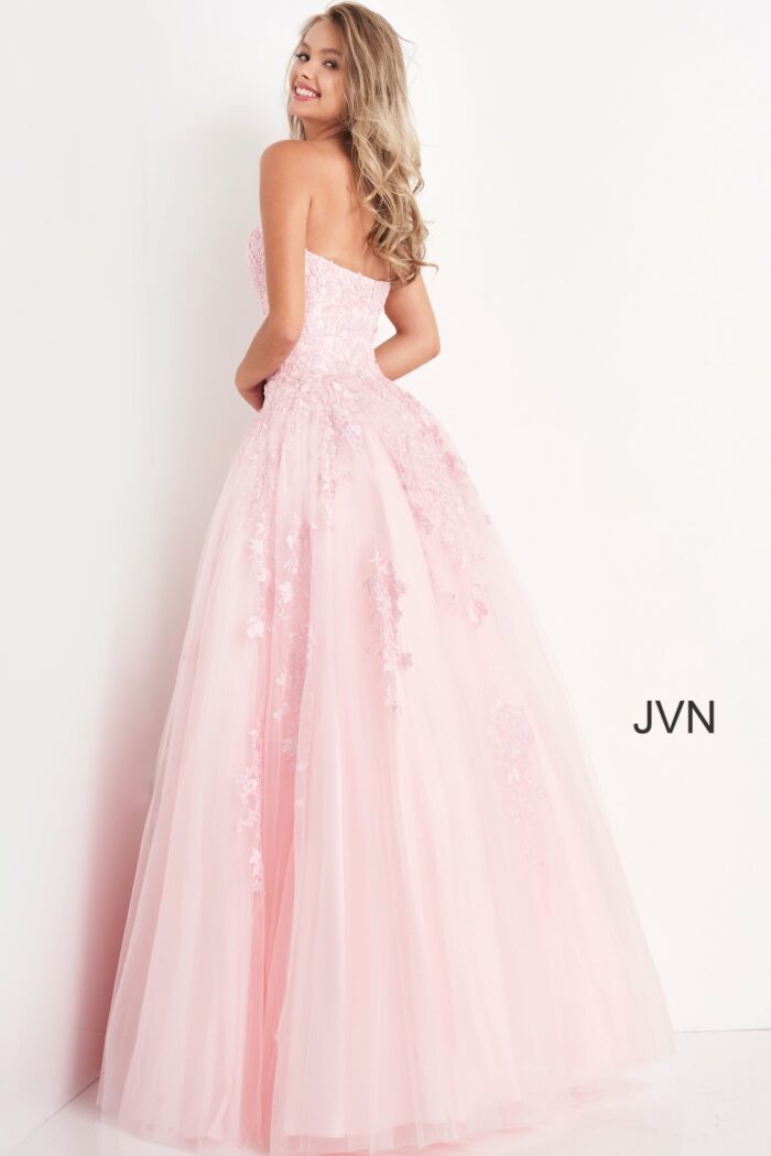 Model wearing Jovani 1831 ball gown in pink, back view