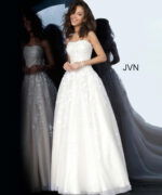 Model wearing Jovani 1831 ball gown in off-white, front view