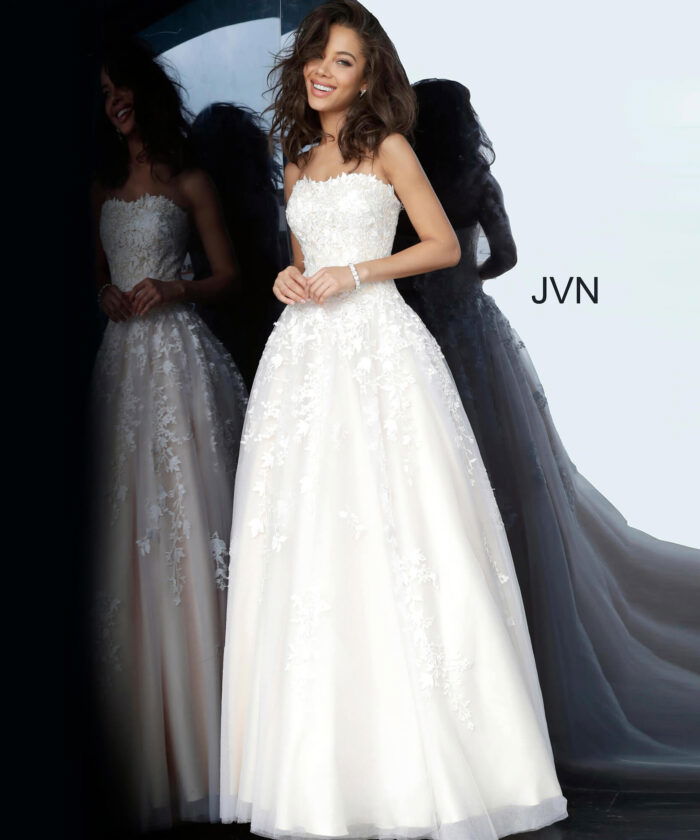 Model wearing Jovani 1831 ball gown in off-white, front view