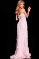 Back view of model wearing Jovani 22343 blush gown with floral details.