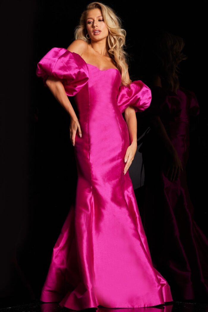 Model posing in Jovani 22830 fuchsia gown with off-the-shoulder design.