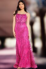 Model wearing Jovani 23250 fuchsia gown highlighted with sequins.