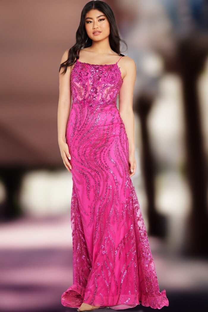 Model wearing Jovani 23250 fuchsia gown highlighted with sequins.