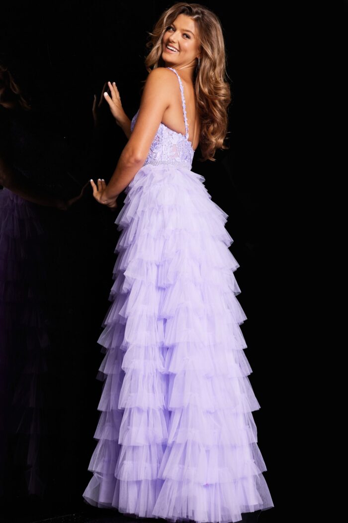 Model wearing Jovani 37001 lilac dress with ruffled skirt, back view.