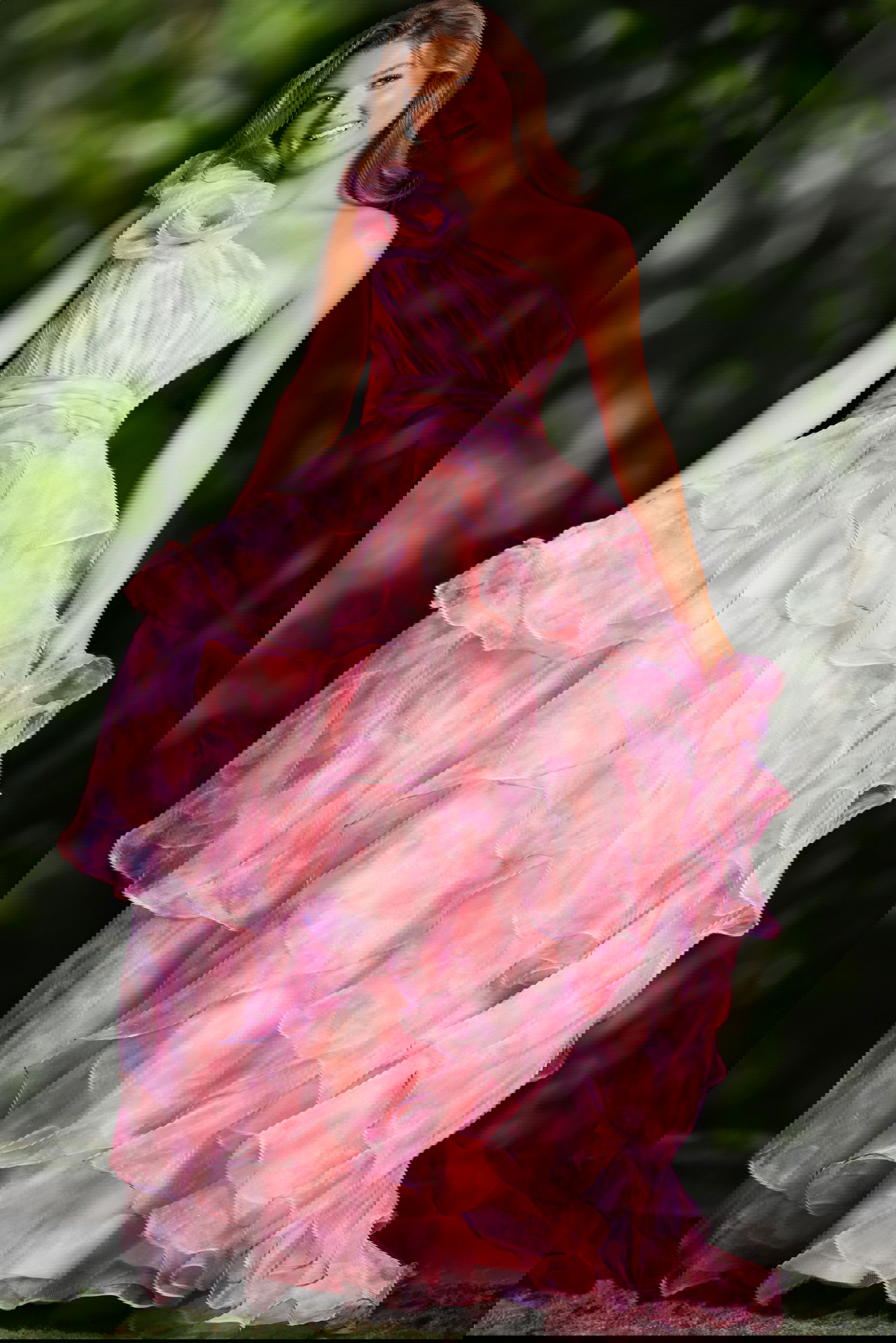 JVN37455_2-.jpg Model wearing Jovani 37455 dress with a one-shoulder neckline and layered pink skirt.