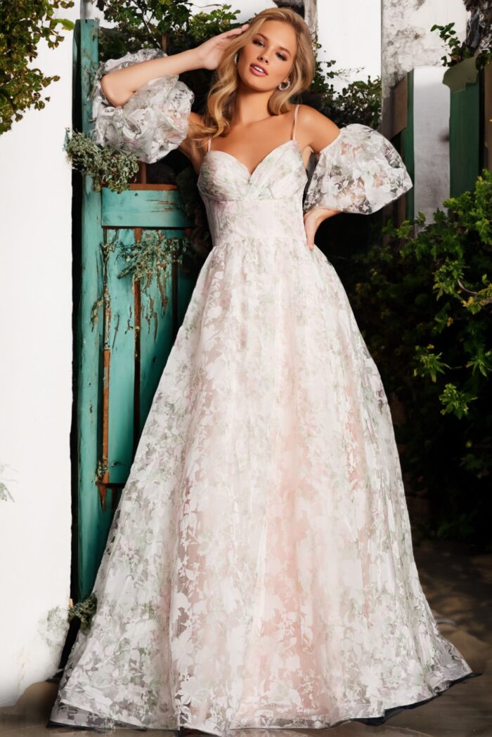 Model posing in Jovani 37531 full-length pink dress with puff sleeves.
