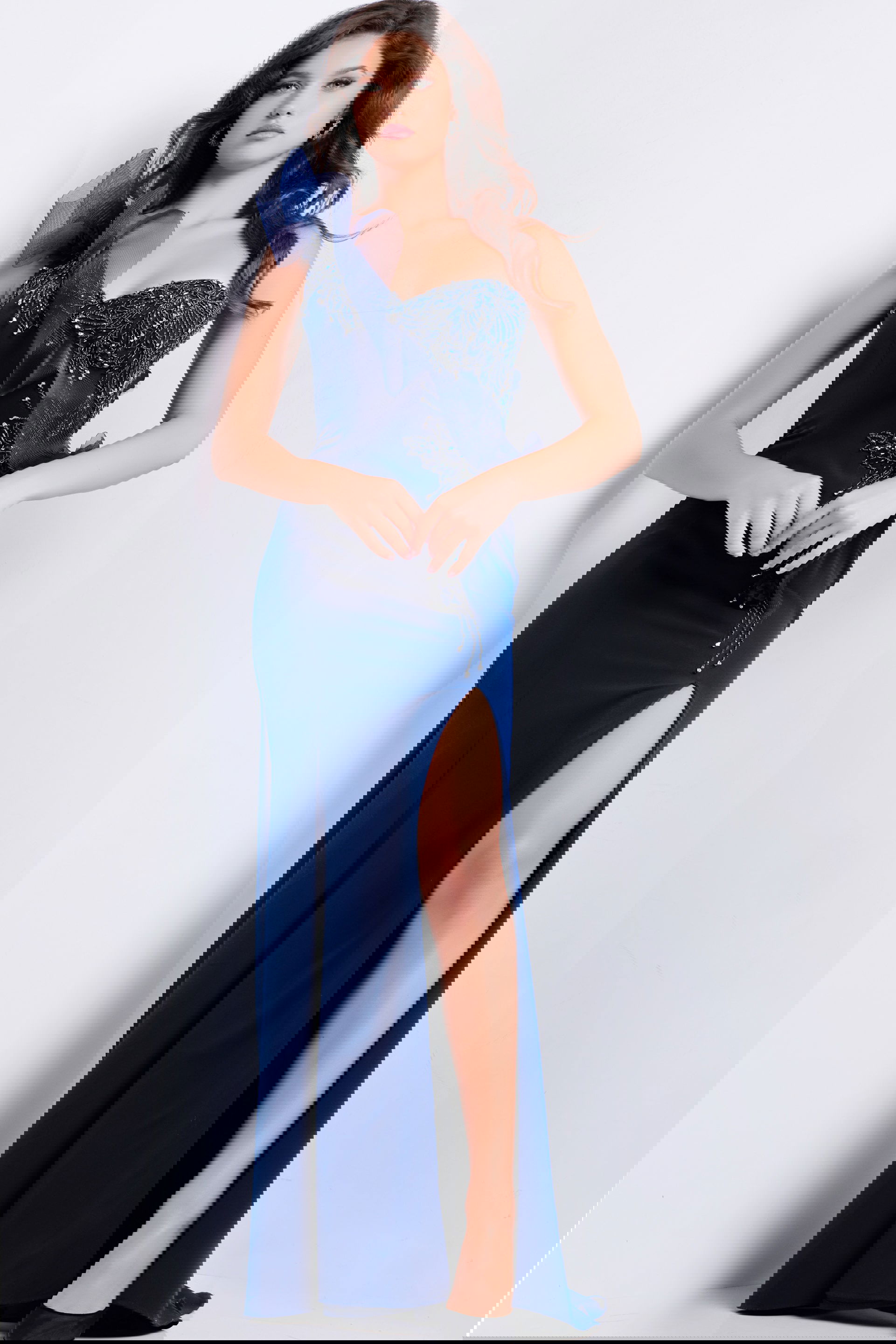 JVN37574_NAVY_2010.jpg Model wearing Jovani 37574 navy evening gown with asymmetrical neckline and high slit