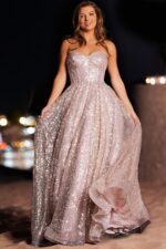 Front view of model wearing Jovani 38607 blush sequined dress.
