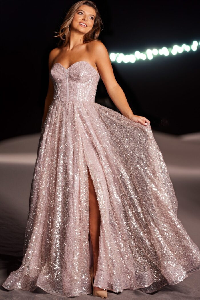 Model in Jovani 38607 blush dress with shimmering sequins and slit.