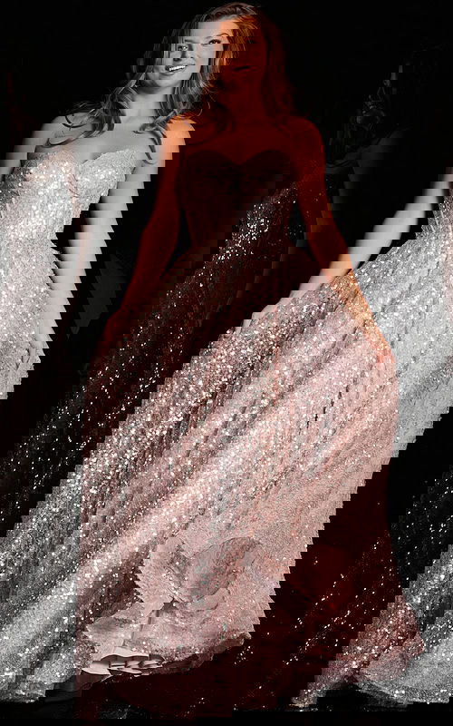 Model wearing Jovani 38607 blush gown with sequins and sweetheart neckline.