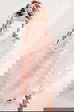 Model wearing Jovani K02442 pink dress with layered tulle skirt, front view.