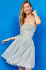 Model wearing Jovani K04445 light Green dress with sparkling embellishments, shown from the front.