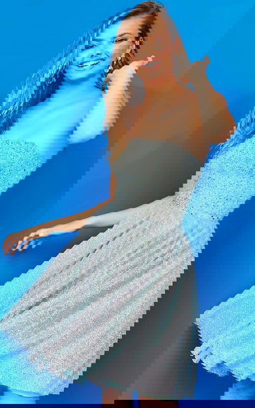 Model wearing Jovani K04445 light Green dress with sparkling embellishments, shown from the front.