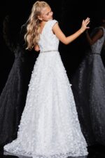 Back view of model in Jovani K07245 ivory gown with cap sleeves and floral appliqué.
