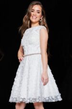 Model wearing K07246 ivory dress with floral appliqués and sparkling waistband.