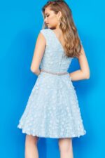 Back view of model wearing K07246 blue dress with V-cut and floral appliqués.
