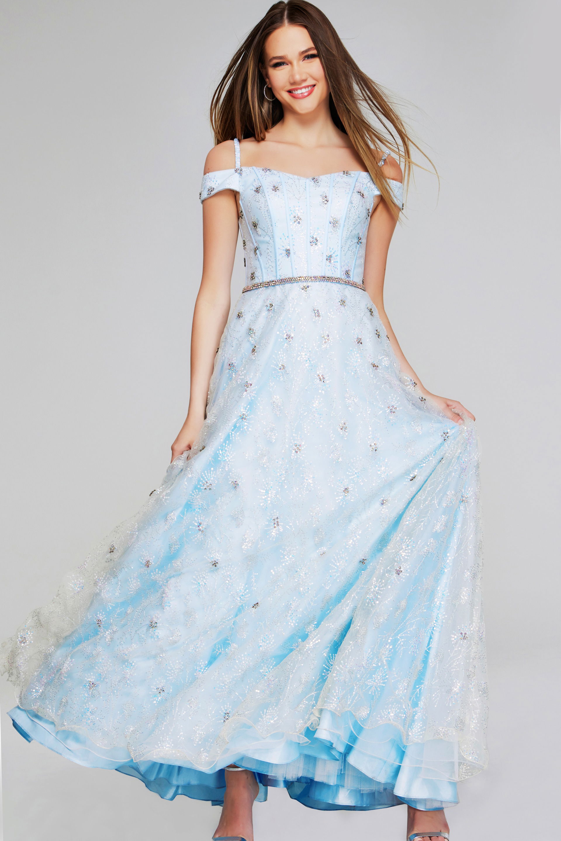 K07282-LIGHTBLUE-207.jpg Model wearing Jovani K07282 light blue dress with off-the-shoulder neckline, front view.