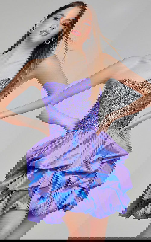 Model wearing Jovani K07390 lilac short dress with beaded sweetheart neckline and ruffled skirt, front view.