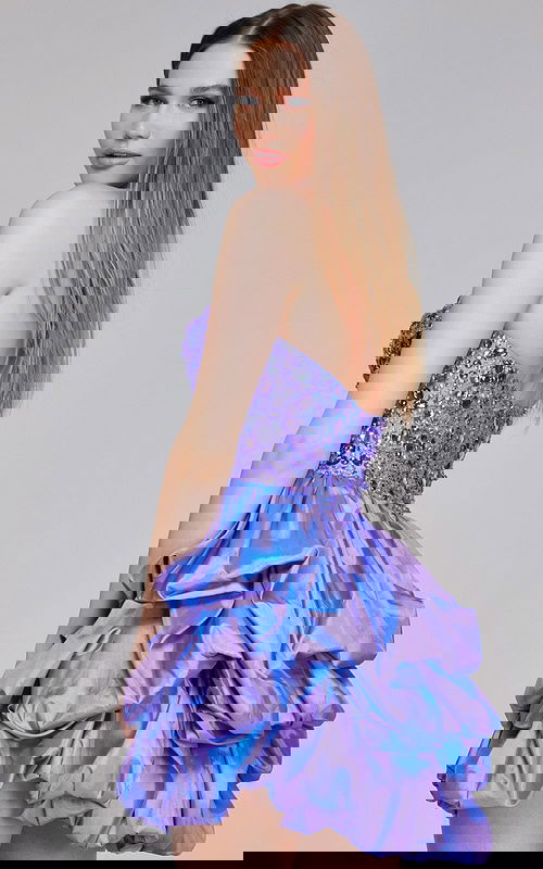 Model wearing Jovani K07390 lilac short dress with beaded sweetheart neckline and ruffled skirt, back view.