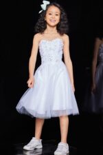 Jovani K07817 dress in white worn by child model, front view.