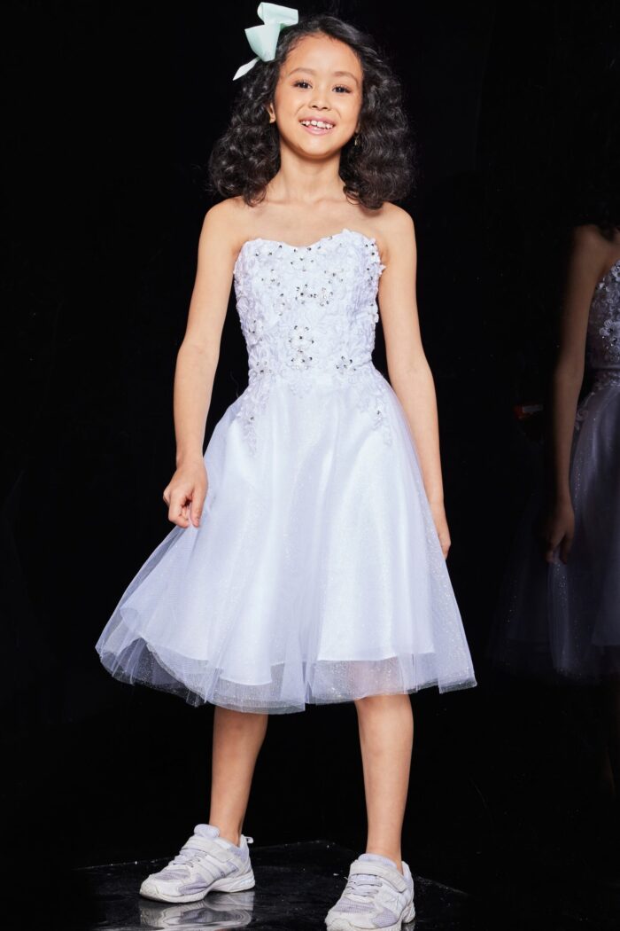 Jovani K07817 dress in white worn by child model, front view.