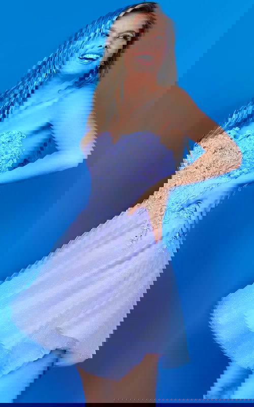 Model showcasing Jovani K07817 dress in lilac with floral lace details, front view.