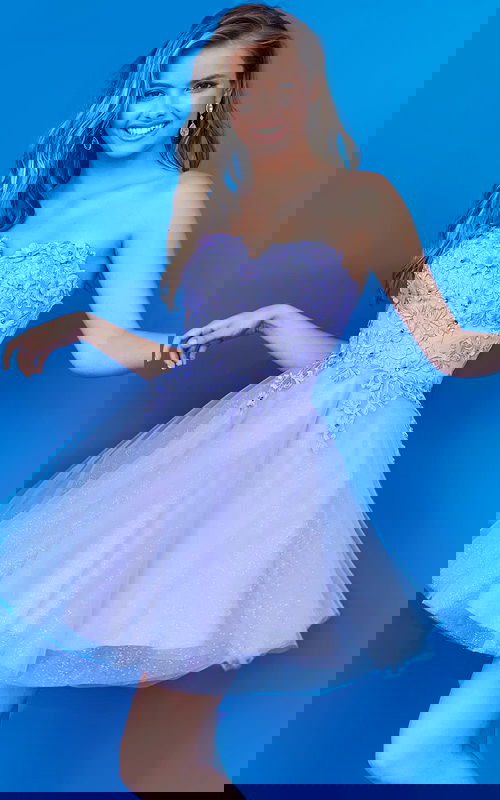 Model wearing Jovani K07817 dress in lilac with floral lace bodice and tulle skirt, front view.